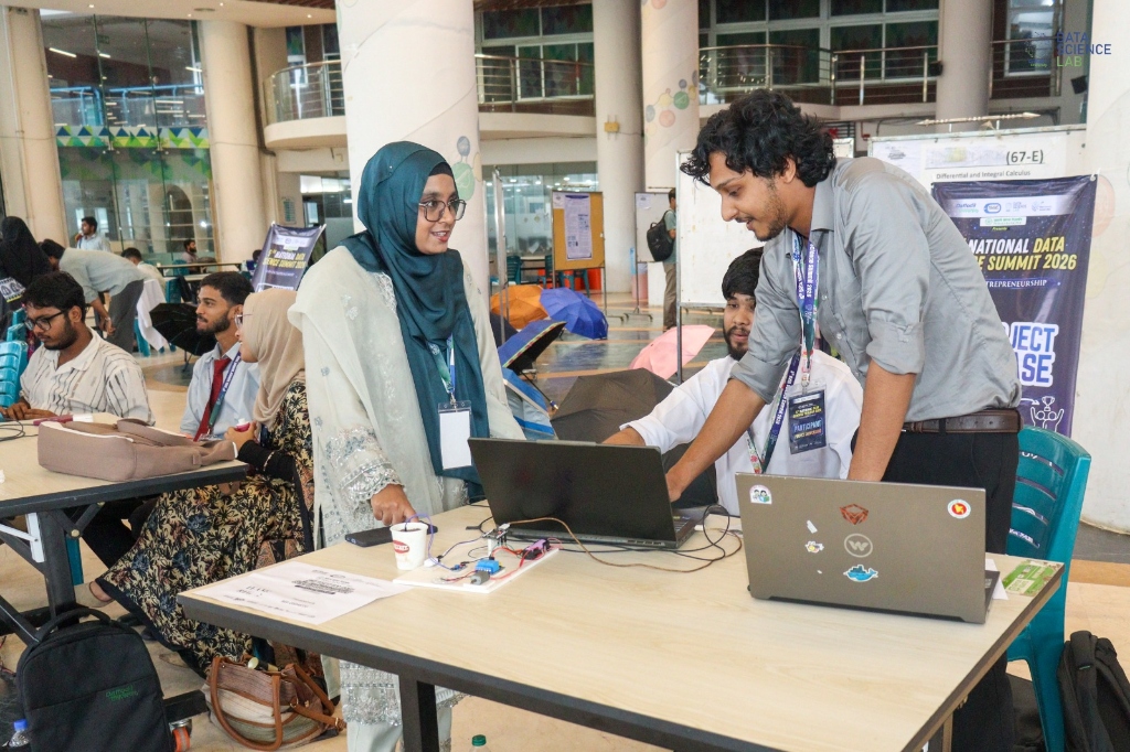 Shafim demonstrating the custom team project to judges and visitors at the 5th National Data Science Summit 2026 Showcase